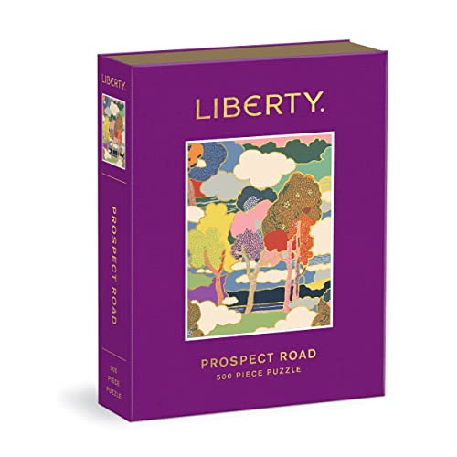 A purple book-style box for a 500-piece puzzle featuring a colorful abstract landscape illustration.