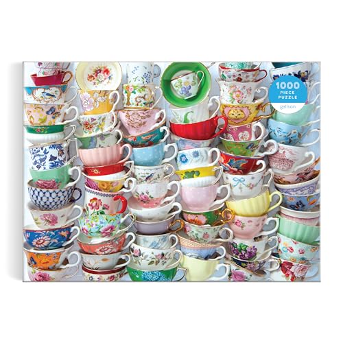 A collage of many colorful, patterned vintage teacups filling the entire frame.
