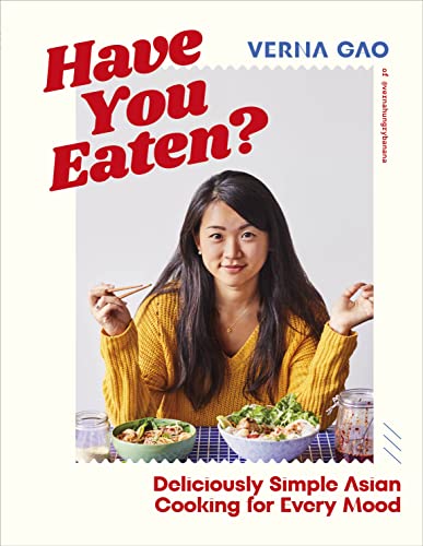 Cookbook cover featuring a woman with noodles, titled "Have You Eaten?".