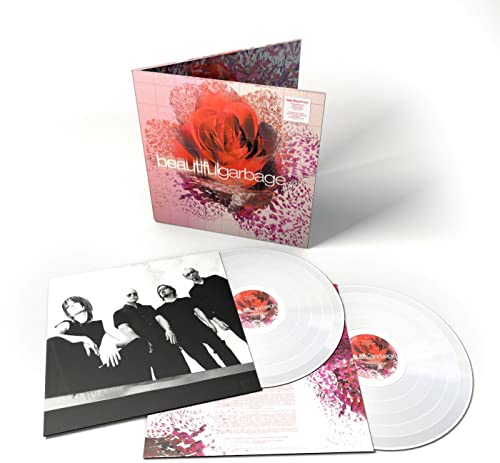 Vinyl record set with album cover, two clear discs, and a lyric booklet.