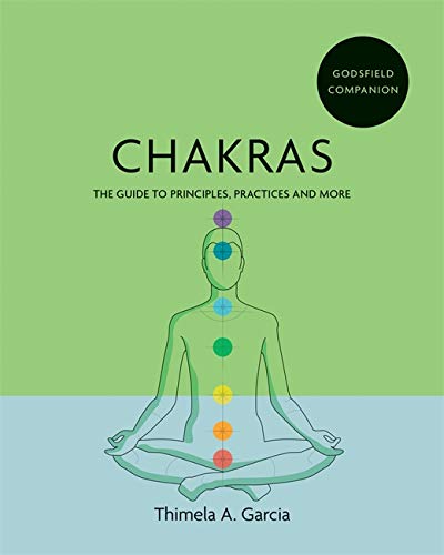 Book cover: "Chakras" with illustration of a person in lotus position.