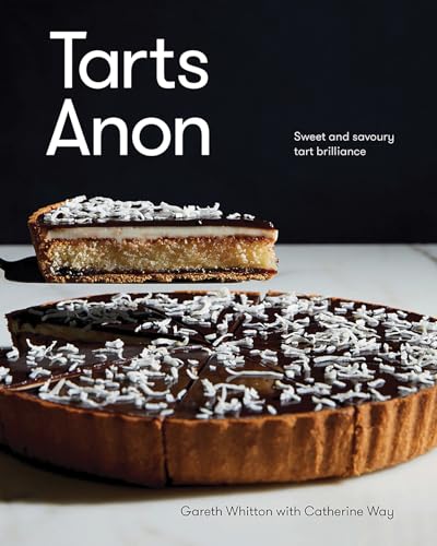 A slice of coconut-topped chocolate tart lifted above a whole tart on a table.