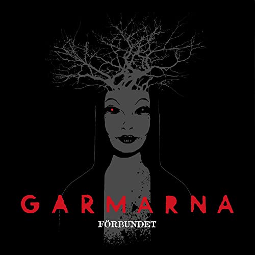 Dark album cover featuring a woman’s face with tree-branch hair and red eyes.