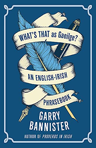 Book cover with quill, pen, and ribbon displaying "What's That as Gaeilge?".