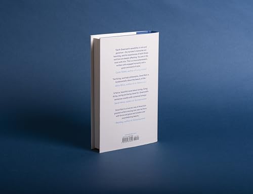 White book spine with blue top edge, barcode at bottom.