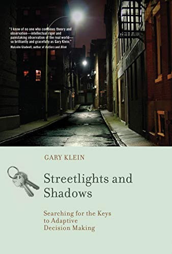 Book cover depicting a dark alleyway under streetlights, with keys imagery.
