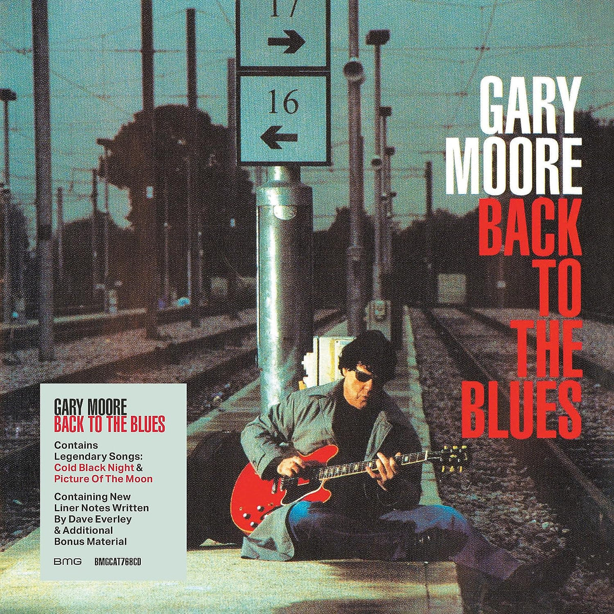 Gary Moore album cover: man with red guitar at a train station.