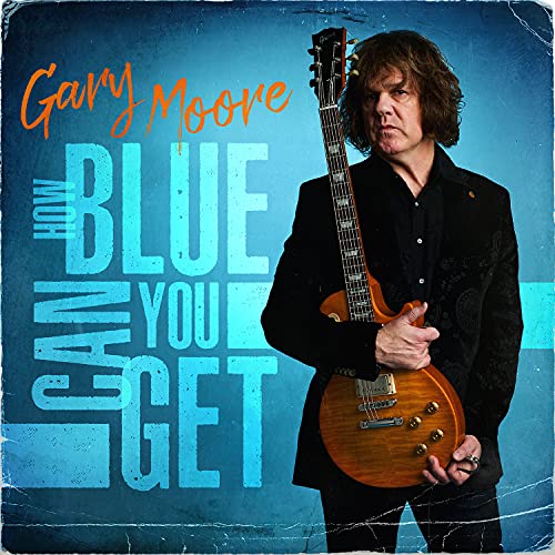 Gary Moore holding an electric guitar against a blue textured background with album text.