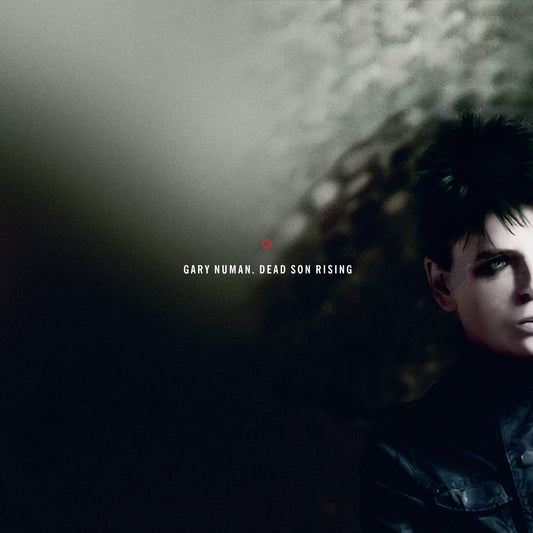 Gary Numan portrait on album cover, dark and moody, with red dot.