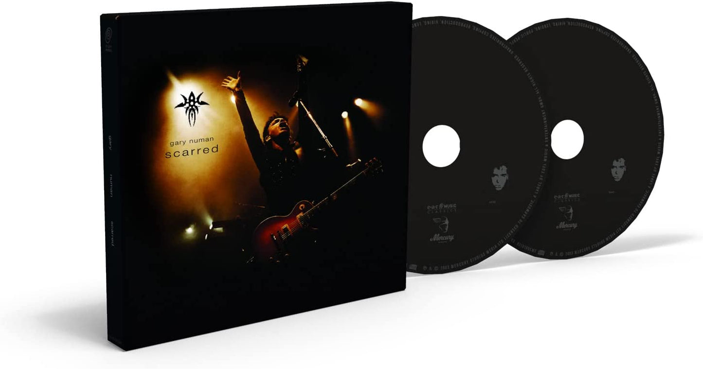 Gary Numan “Scarred” CD case featuring a performer with a guitar.