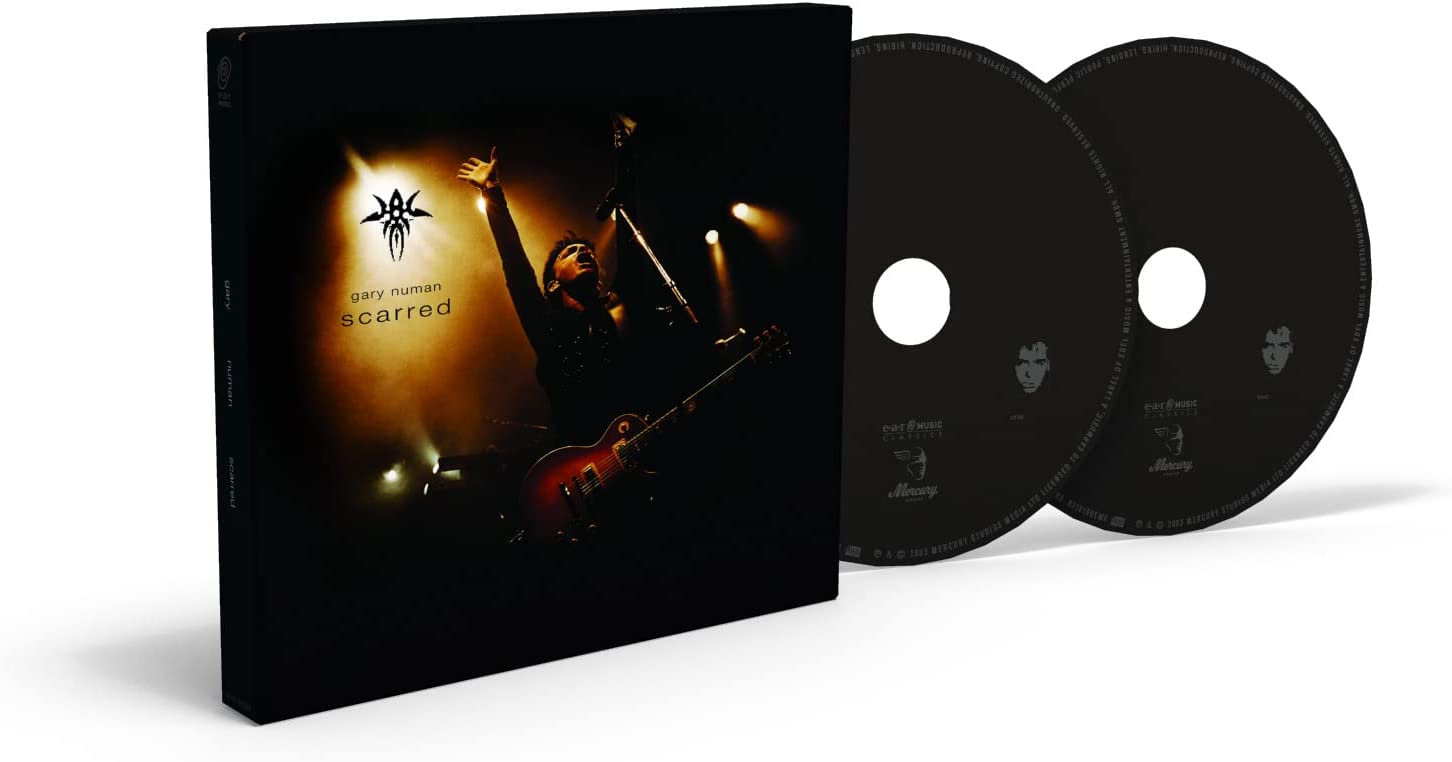 Gary Numan “Scarred” CD case featuring a performer with a guitar.