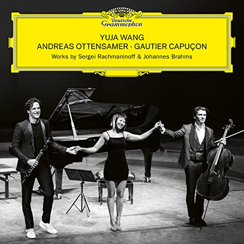 Andreas Ottensamer, Yuja Wang, and Gautier Capuçon standing on stage with instruments.