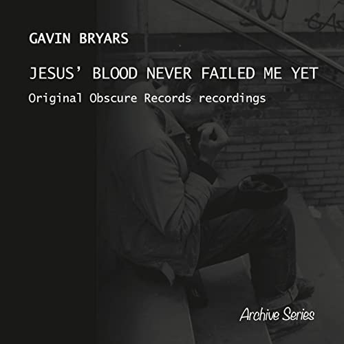 Album cover featuring a man sitting on steps with text overlaying the image.