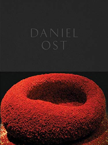 Book cover featuring a circular floral arrangement in red tones.