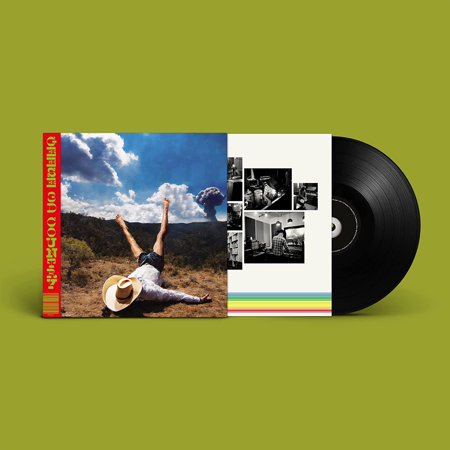 Vinyl record and album cover featuring a person doing a handstand in a field.