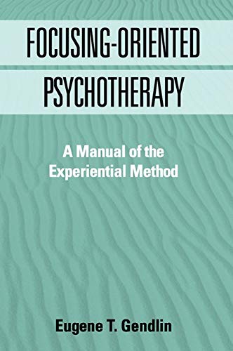 Book cover titled Focusing-Oriented Psychotherapy by Eugene T. Gendlin against a rippled sand background.