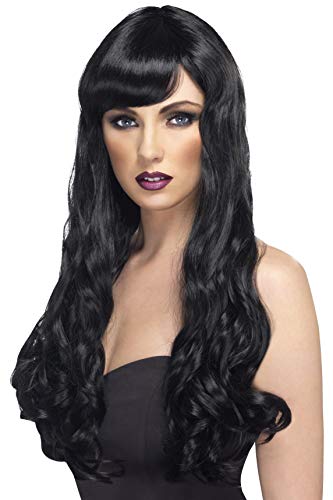 Woman modeling a long, black curly wig with bangs.