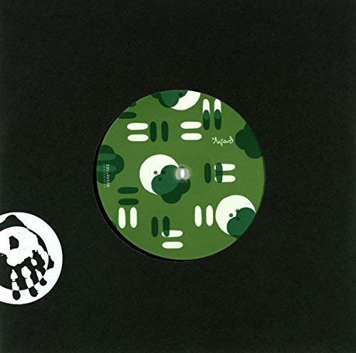A vinyl record with a green patterned label on a black background.