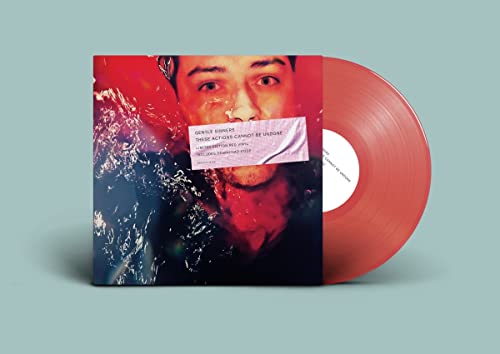 Red vinyl record with album cover featuring a man’s face and red splashes.
