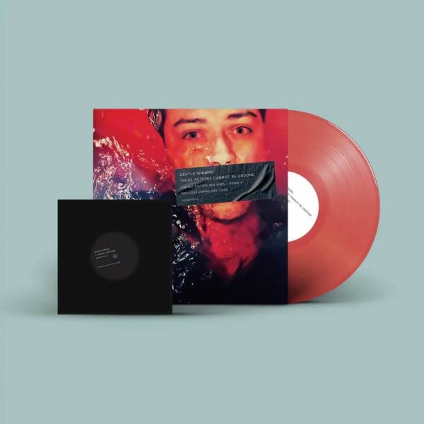 Vinyl record with a portrait cover and a red disc, with black sleeve.