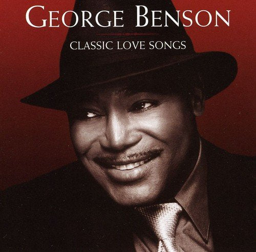 George Benson wearing a fedora on a dark red background, titled Classic Love Songs.