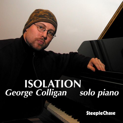George Colligan wearing a beanie and glasses, posing with a grand piano.