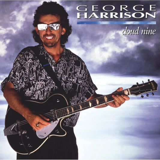 George Harrison with guitar on the album cover for Cloud Nine.