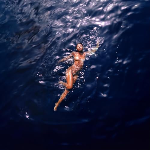 Woman submerged in dark blue water, arms outstretched, album cover.