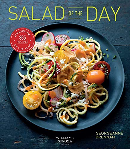 Cookbook cover featuring a colorful salad with zucchini noodles and tomatoes.