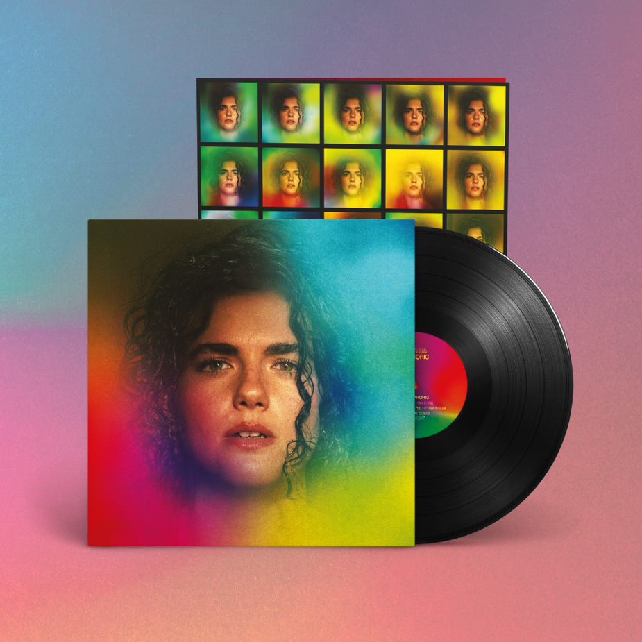 "Vinyl record sleeve with a woman's portrait and rainbow background, partially covering the inner sleeve."