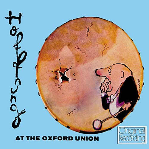 CD cover: cartoon mole conducting, cracked orange circle, blue background.