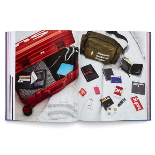 Open book page displaying a red suitcase and various fashion accessories.