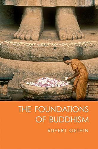 Book cover with a person praying before a Buddha statue and flowers.