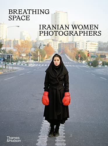 Book cover: Woman in hijab and boxing gloves on a city street.