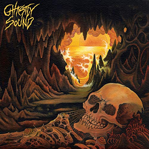 CD cover: skull in a cave with a fiery, surreal landscape.