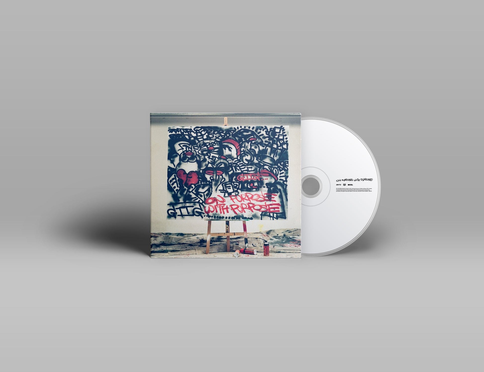 CD case with graffiti-style artwork and a silver compact disc.