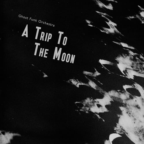 Vinyl record cover: "A Trip To The Moon" with lunar imagery.