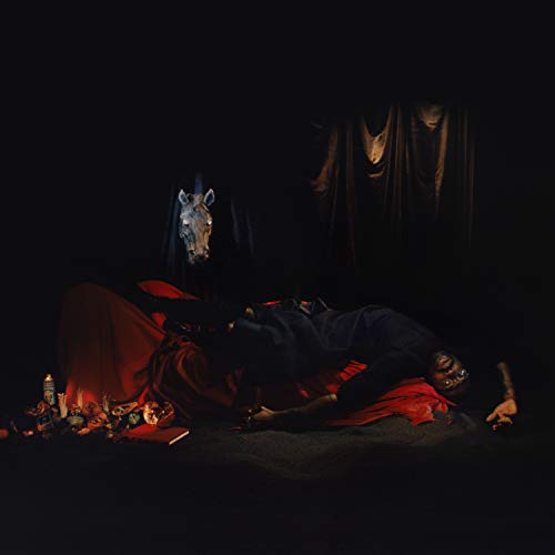 Dark album cover featuring a person reclining with a horse skull.