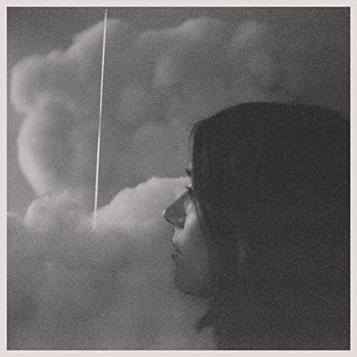 Black and white album cover featuring a woman’s profile against clouds.