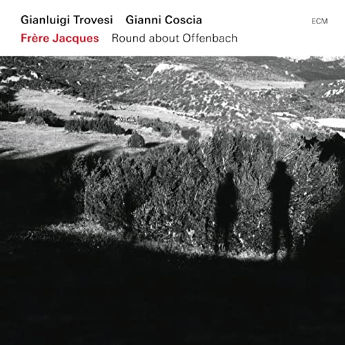 CD cover: black and white landscape with two silhouetted figures.