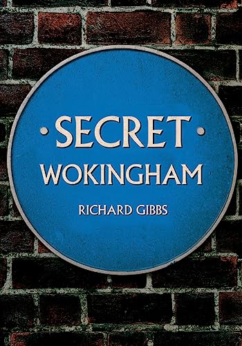 A blue circular plaque with the text Secret Wokingham by Richard Gibbs on brickwork.