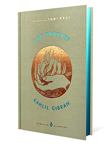 Hardcover book, “The Prophet” by Kahlil Gibran, with a flame illustration.