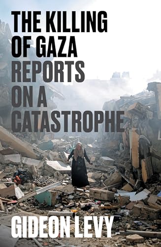 A woman in a hijab walks through rubble in front of a ruined building.
