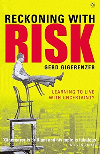 Book cover: yellow background, man on chairs over a city scene.