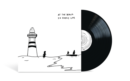 Vinyl record with album cover depicting a lighthouse, person, and boat.