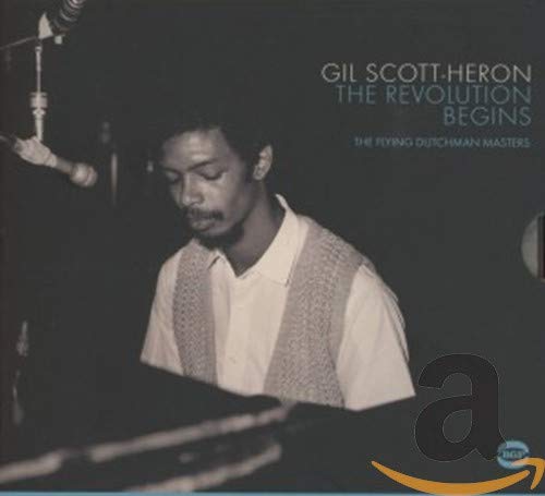 Gil Scott-Heron album cover, black and white photo of musician at piano.