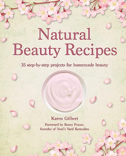 Book cover with pink blossoms, cream, and title “Natural Beauty Recipes”.