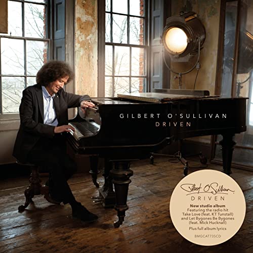 Gilbert O'Sullivan album cover: man at a piano, "Driven" title.