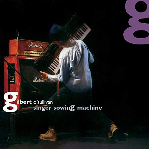 "Album cover featuring Gilbert O'Sullivan playing a piano on stage, with text and purple design."
