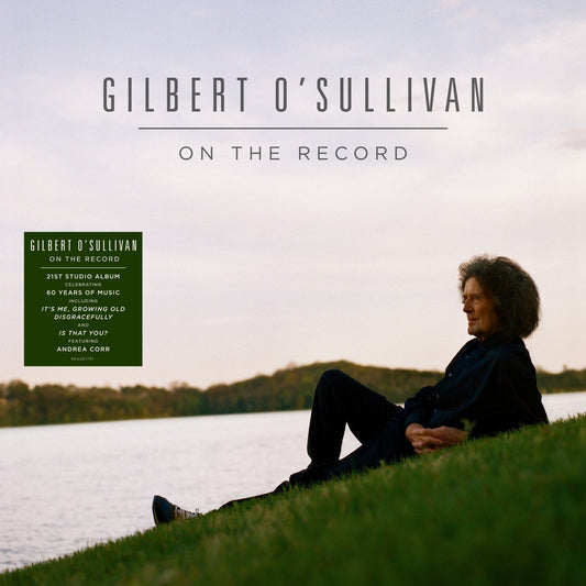 Gilbert O'Sullivan album cover: portrait of a man in a field.